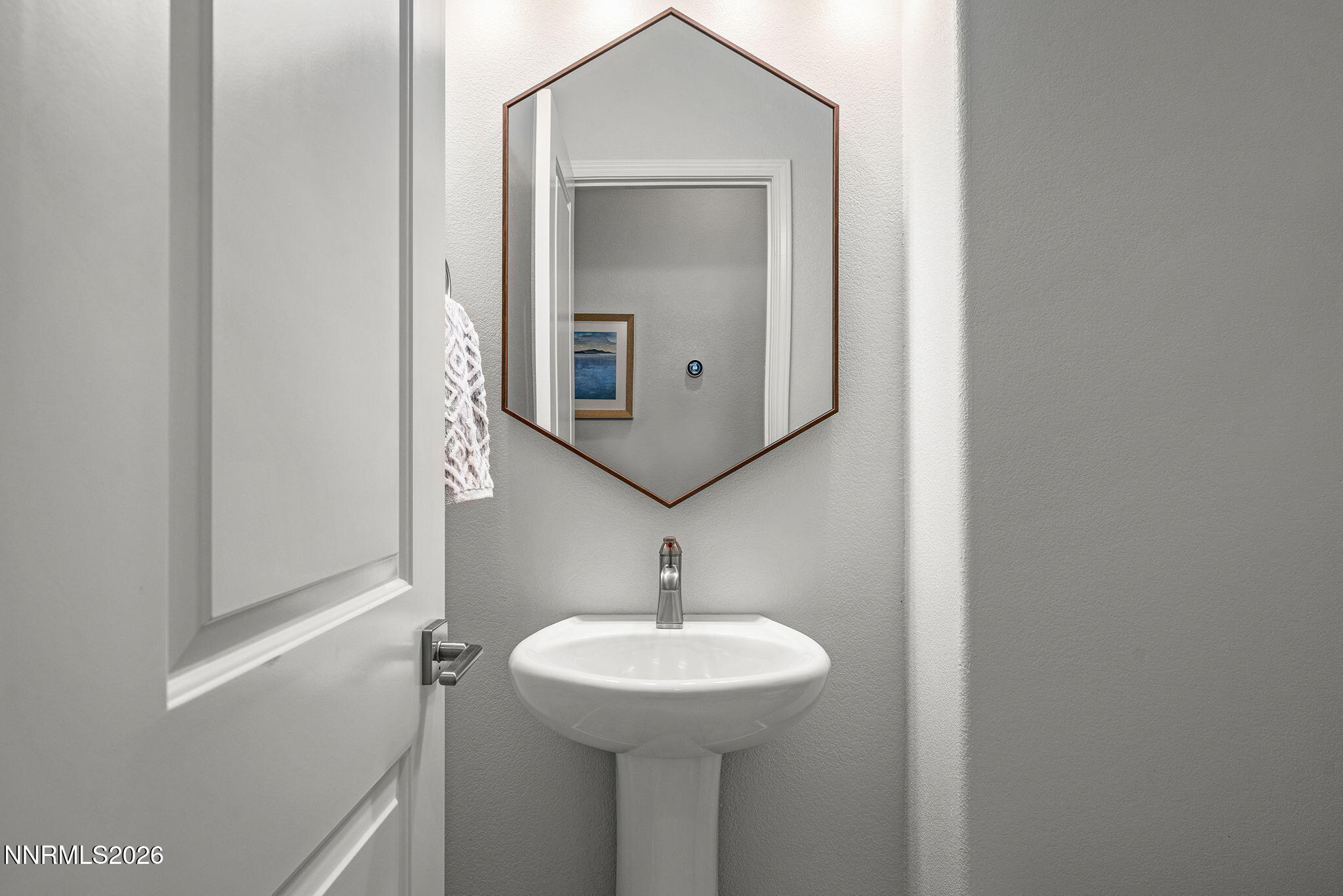 531 Riverbed Circle Reno, NV 89521 - Photo 20 of 32 a bathroom with a sink and a mirror