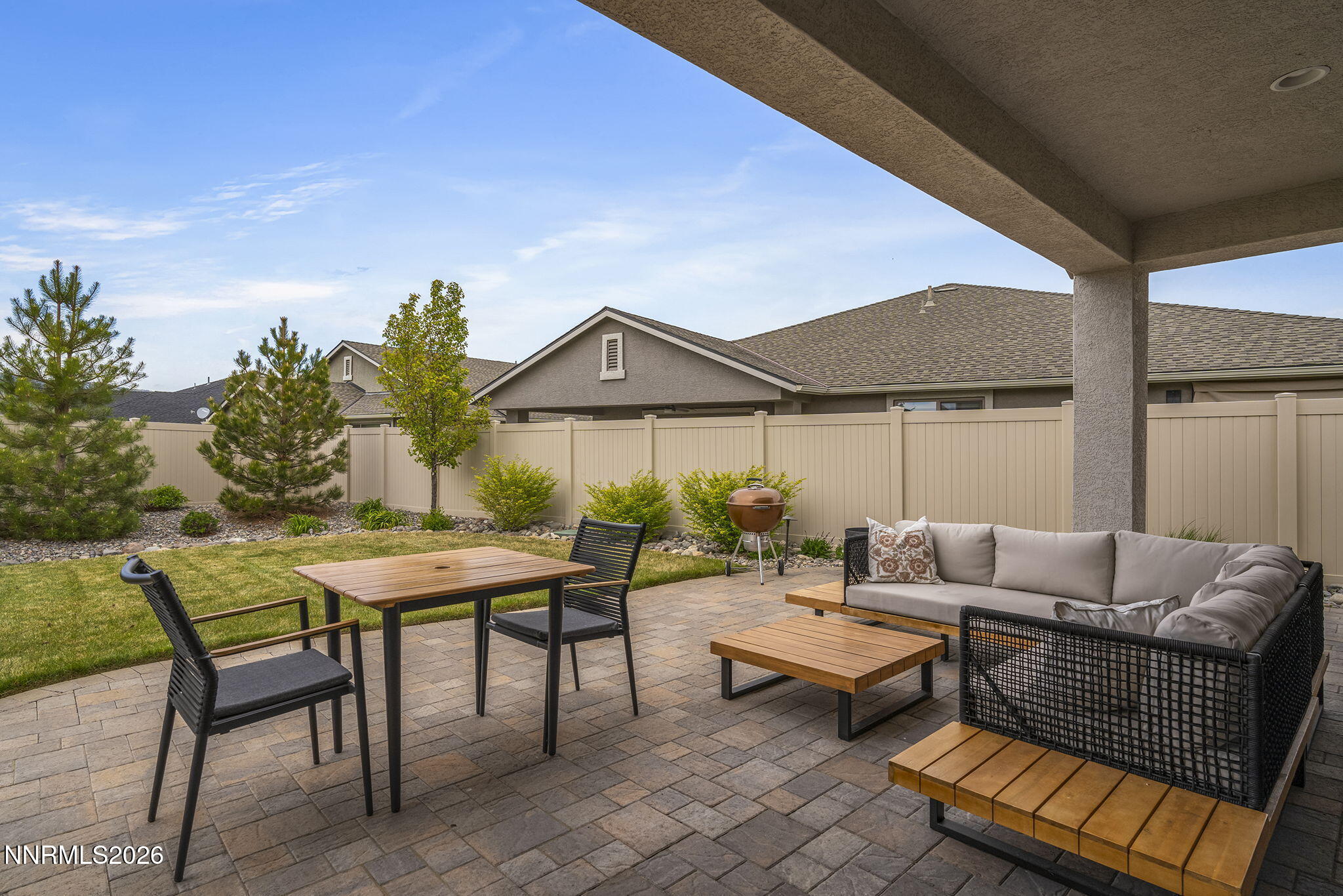 531 Riverbed Circle Reno, NV 89521 - Photo 23 of 32 a patio with patio a couch and chairs