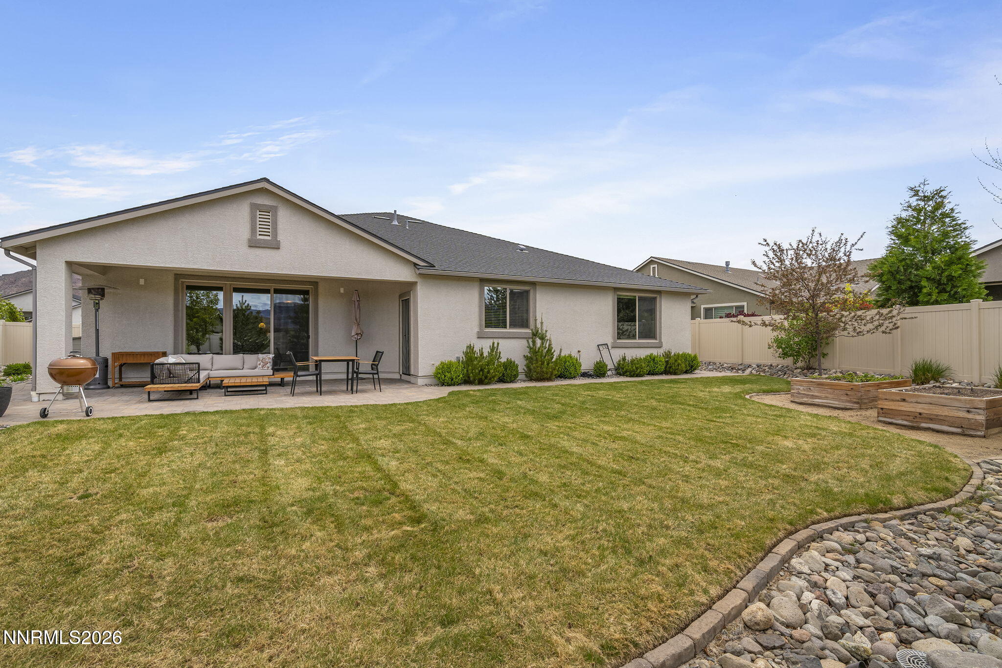 531 Riverbed Circle Reno, NV 89521 - Photo 26 of 32 a front view of a house with swimming pool having outdoor seating