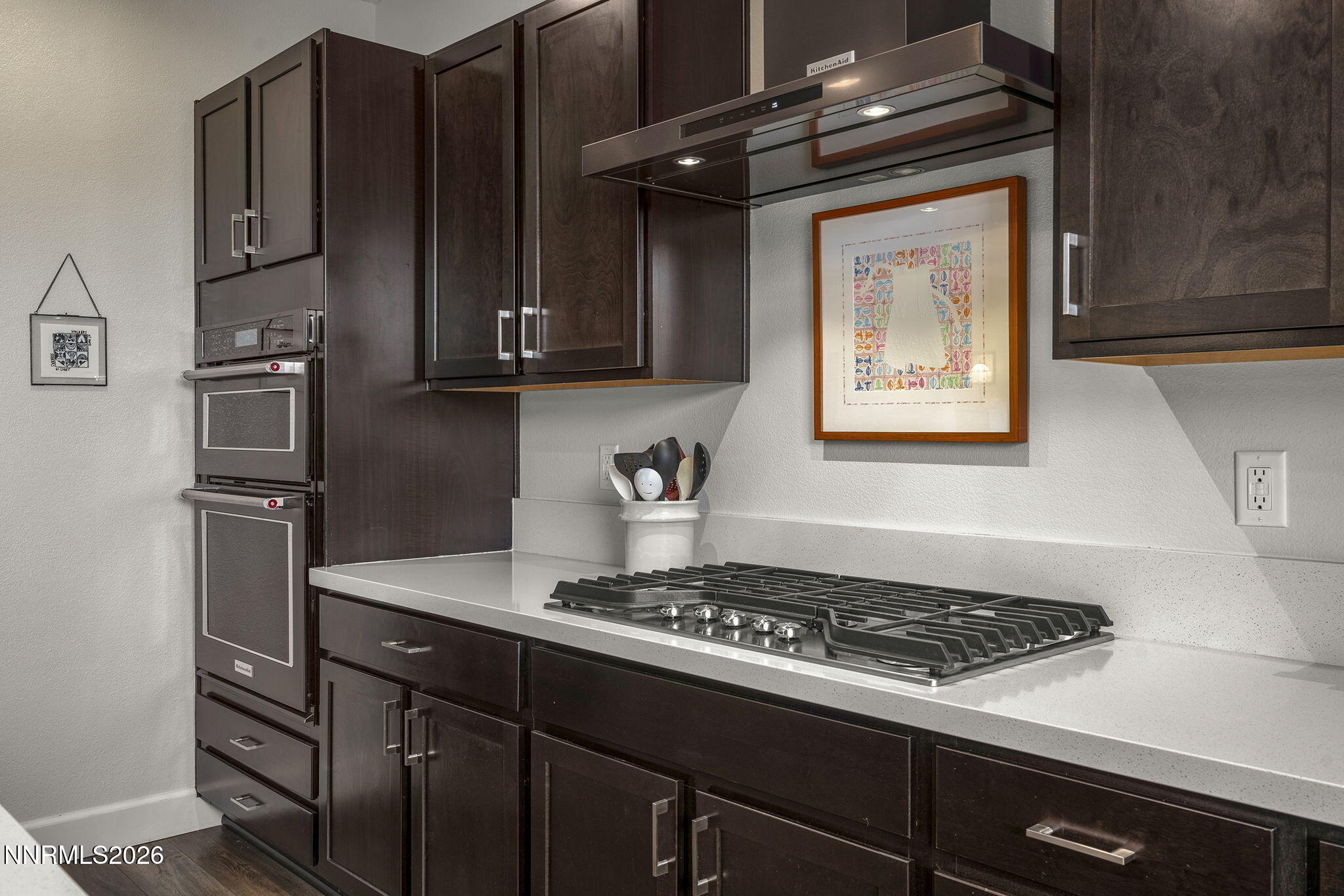 531 Riverbed Circle Reno, NV 89521 - Photo 5 of 32 a kitchen with granite countertop a stove and a refrigerator