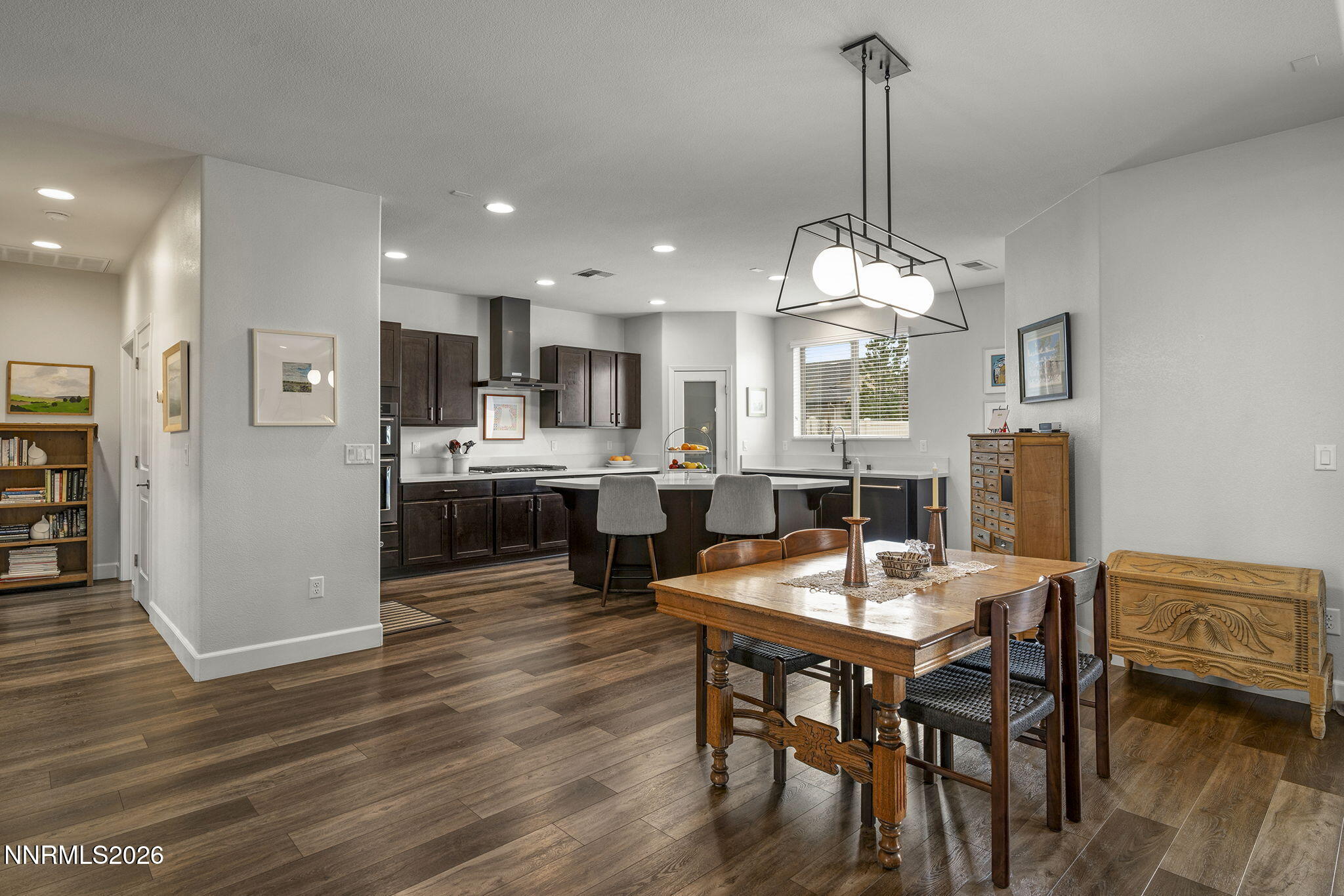 531 Riverbed Circle Reno, NV 89521 - Photo 8 of 32 a view of a dining room with furniture and wooden floor