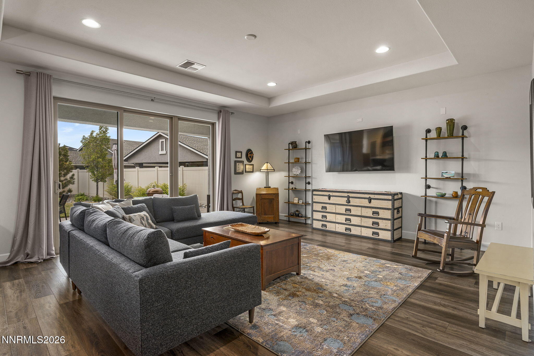 531 Riverbed Circle Reno, NV 89521 - Photo 10 of 32 a living room with furniture and a flat screen tv
