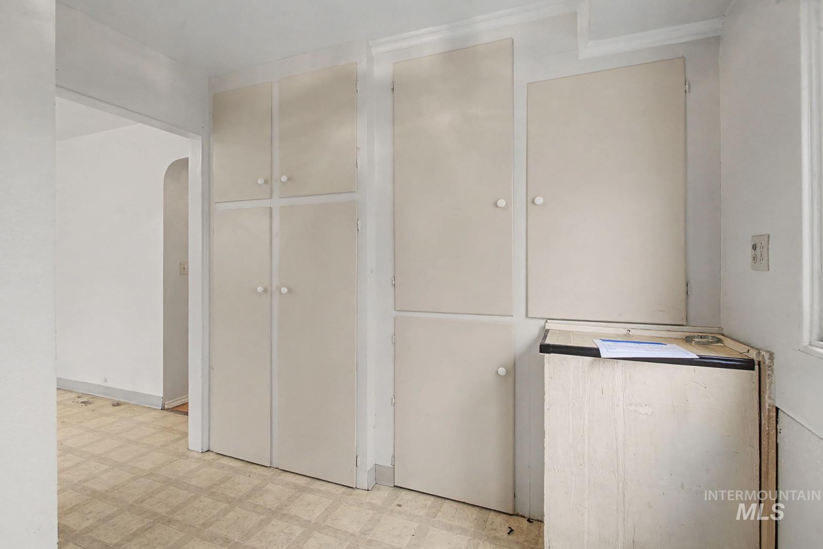 918 Elm Street Clarkston, WA 99403 - Photo 20 of 35 Kitchen featuring light floors and arched walkways
