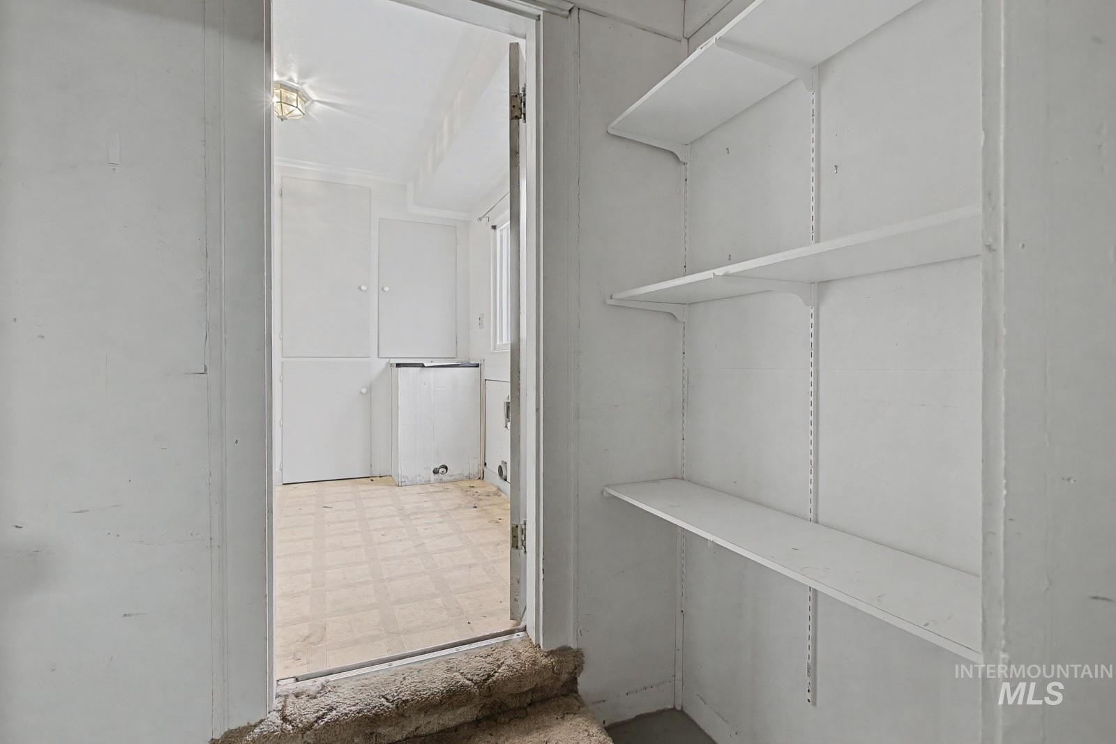 918 Elm Street Clarkston, WA 99403 - Photo 27 of 35 Walk in closet with tile patterned floors