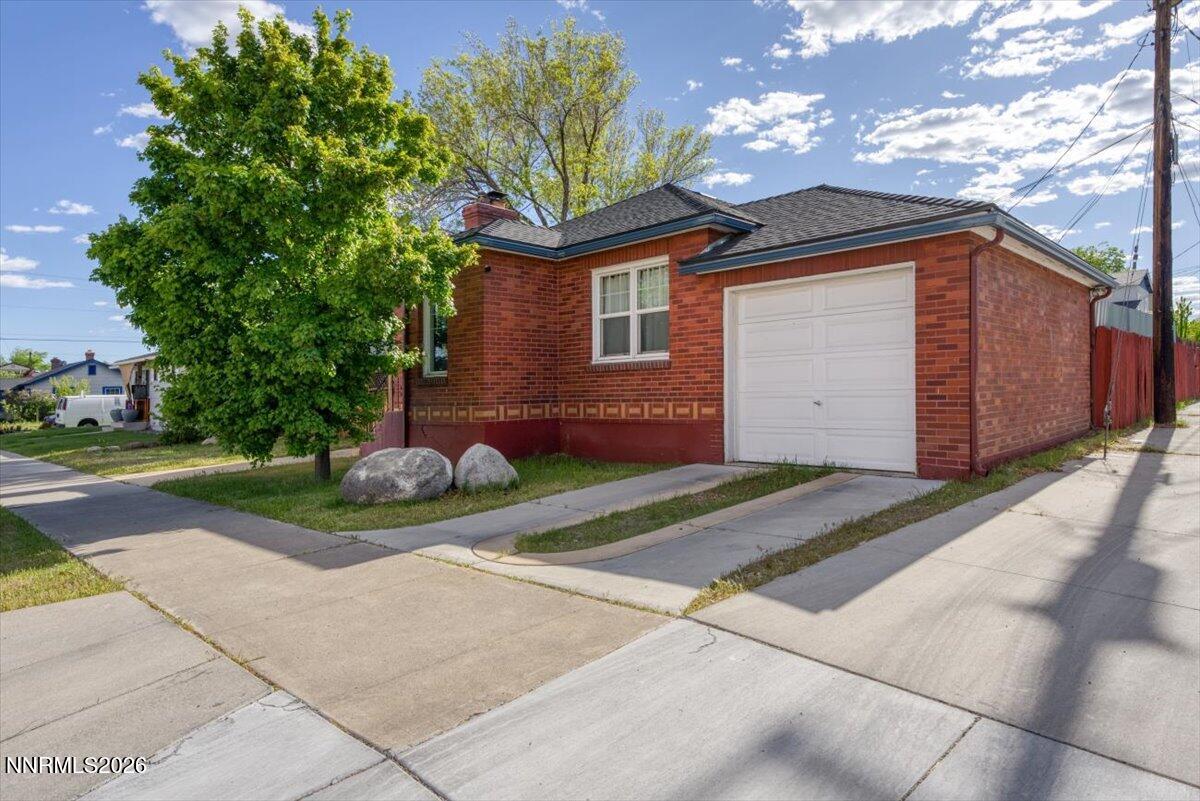 1025 Locust Street Reno, NV 89502 - Photo 1 of 28 a front view of a house with garden