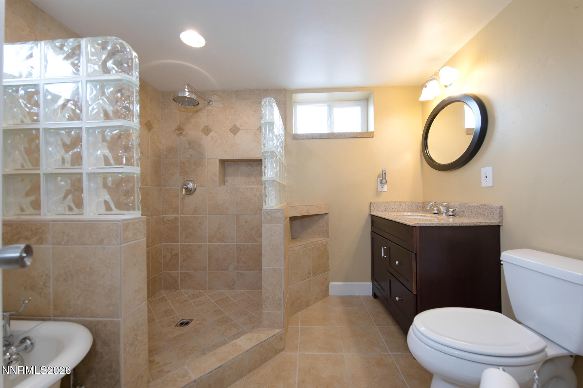 1025 Locust Street Reno, NV 89502 - Photo 15 of 28 a bathroom with a sink a toilet and shower