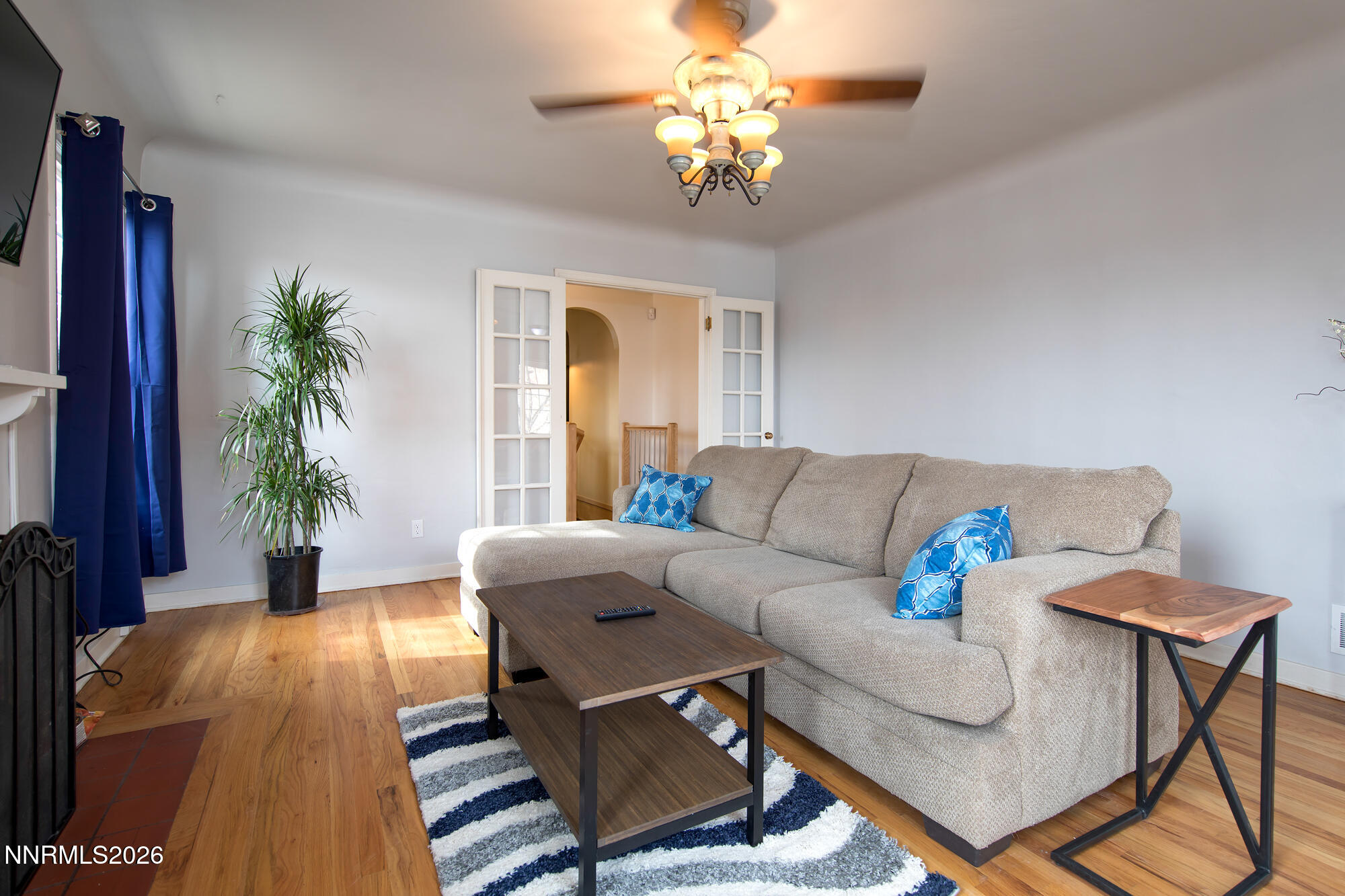 1025 Locust Street Reno, NV 89502 - Photo 2 of 28 a living room with furniture and a chandelier