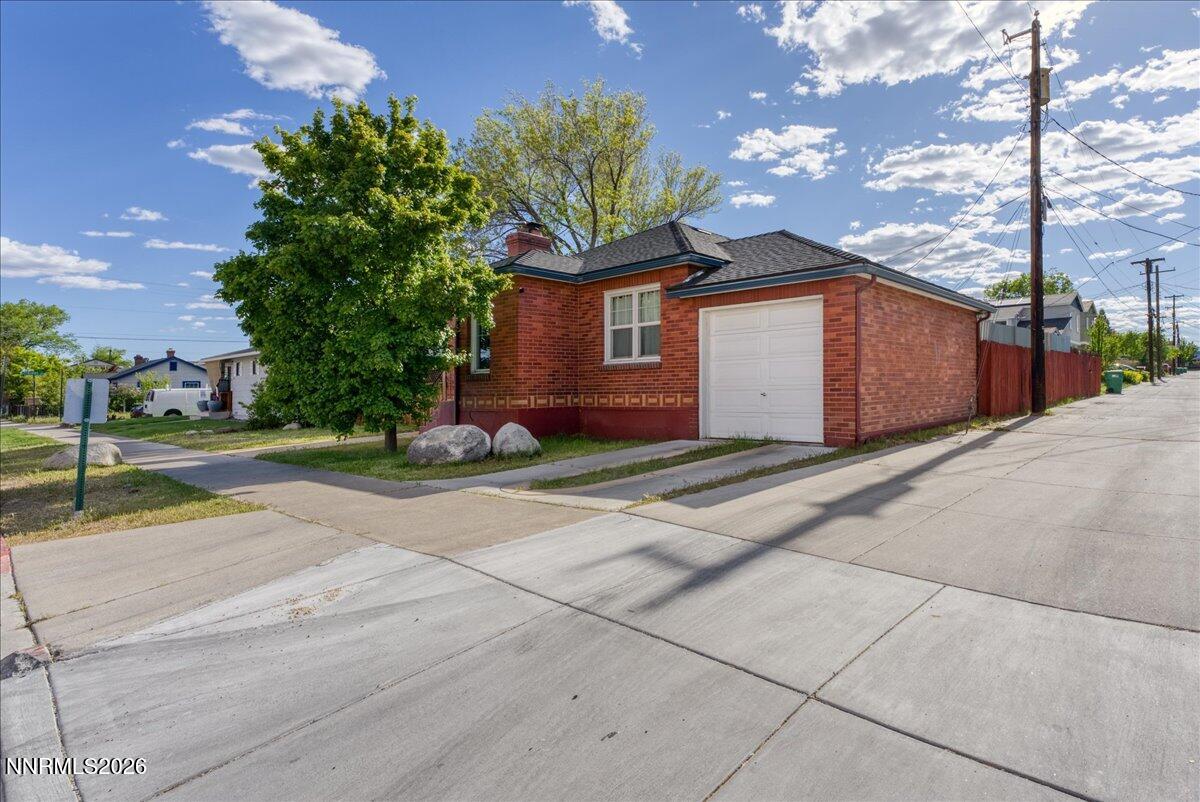 1025 Locust Street Reno, NV 89502 - Photo 22 of 28 a front view of a house with a yard and garage