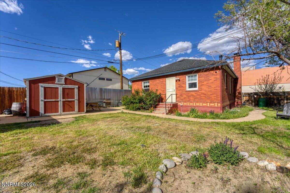1025 Locust Street Reno, NV 89502 - Photo 24 of 28 a front view of a house with a yard and garage