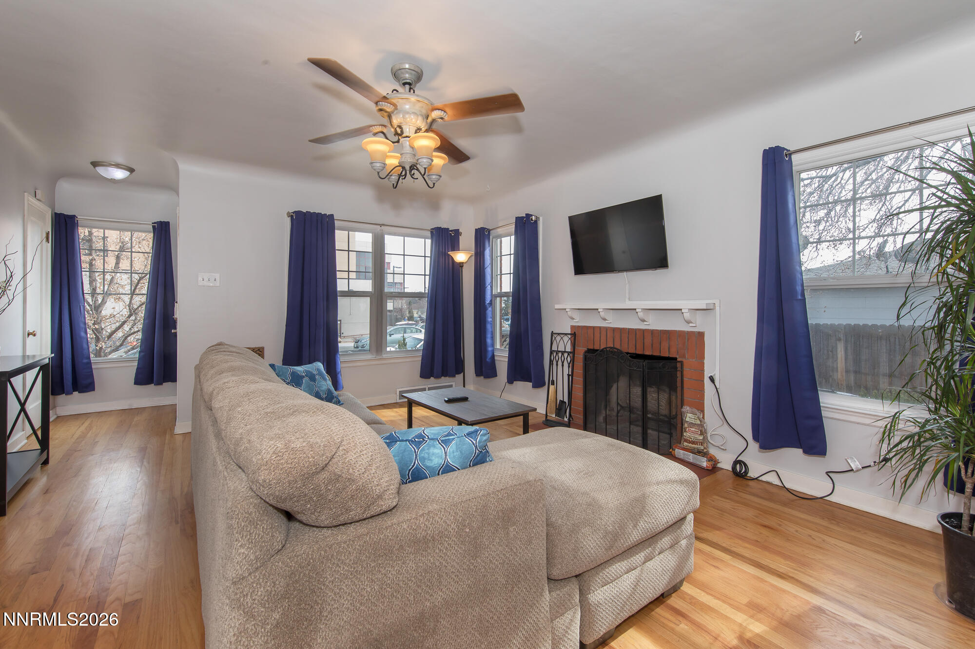 1025 Locust Street Reno, NV 89502 - Photo 3 of 28 a living room with fireplace furniture and a flat screen tv