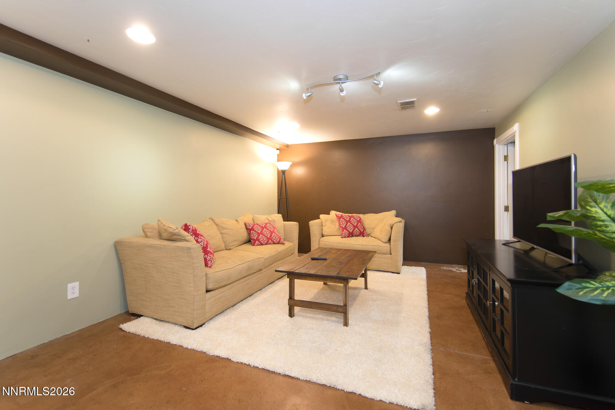 1025 Locust Street Reno, NV 89502 - Photo 10 of 28 a living room with furniture and a flat screen tv