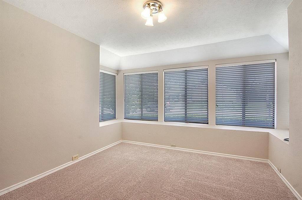 5806 Smoke Glass Trail Dallas, TX 75252 - Photo 20 of 35 an empty room with a window