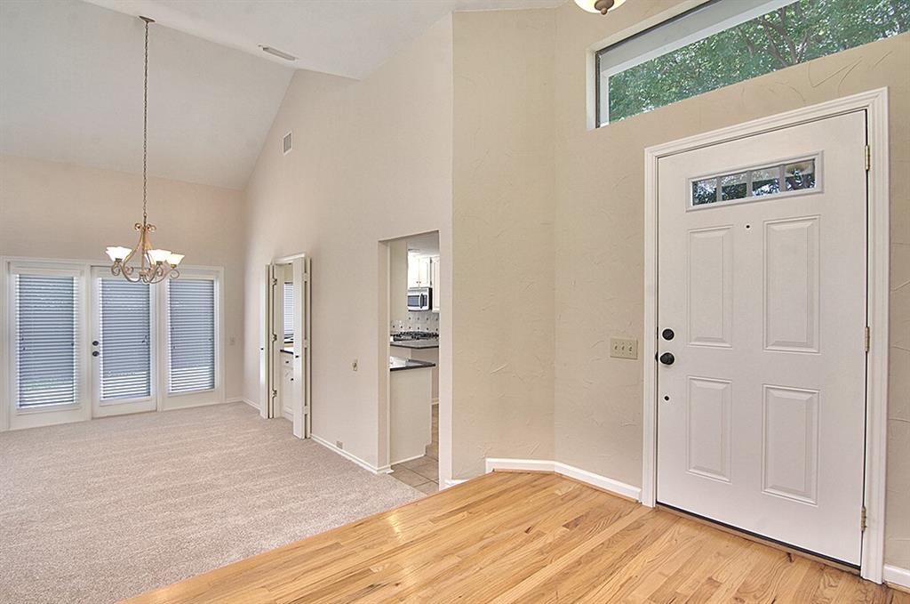 5806 Smoke Glass Trail Dallas, TX 75252 - Photo 24 of 35 a view of a livingroom with a hallway