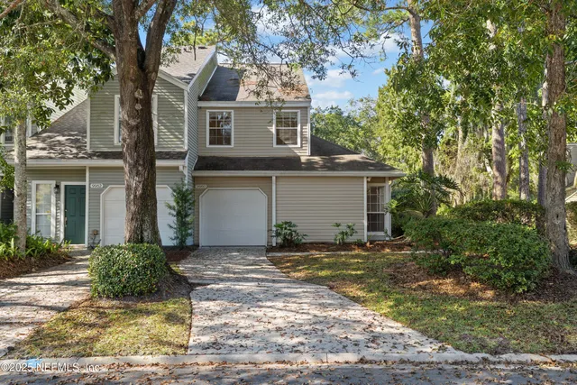a kitchen with a refrigerator stove and cabinets