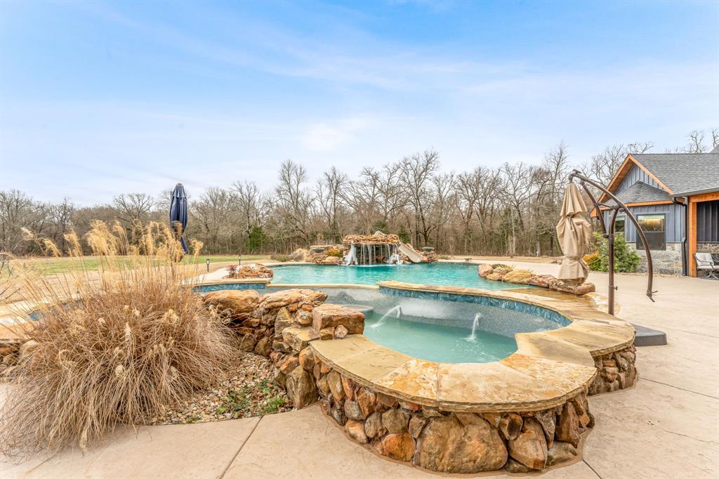 239 32507th Road Paris, TX 75460 - Photo 29 of 40 Outdoor pool with a patio and an outdoor hot tub