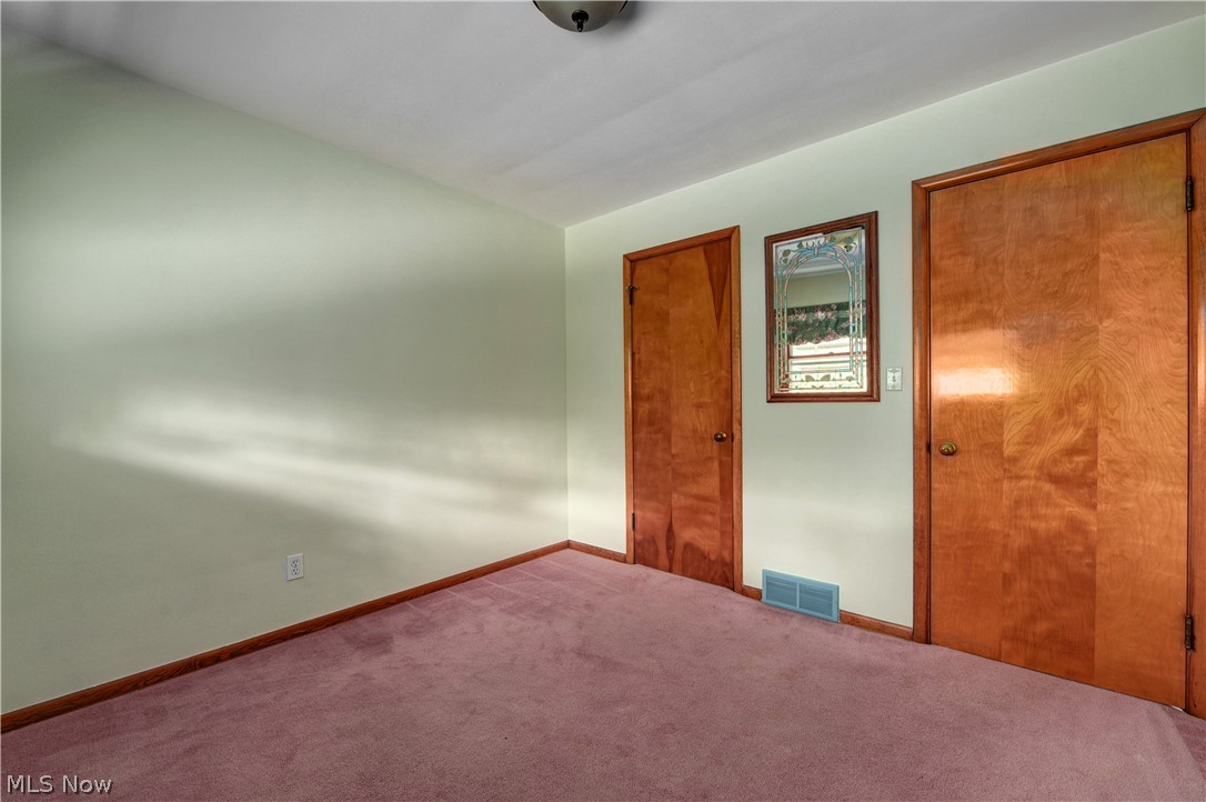 7590 Webster Road Cleveland, OH 44130 - Photo 10 of 16 Hardwood under all bedroom carpets.