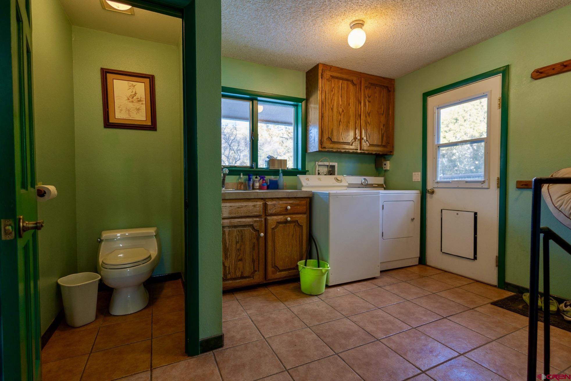 301 Tree Farm Drive Basalt, CO 81621 - Photo 13 of 35 a room with a washing machine and sink