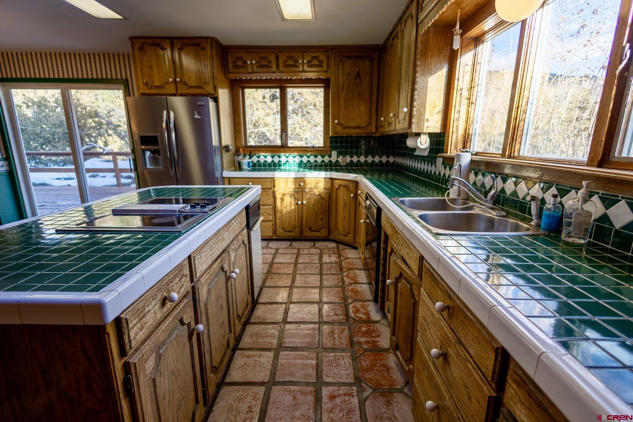 301 Tree Farm Drive Basalt, CO 81621 - Photo 17 of 35 a kitchen with sink a window and cabinets
