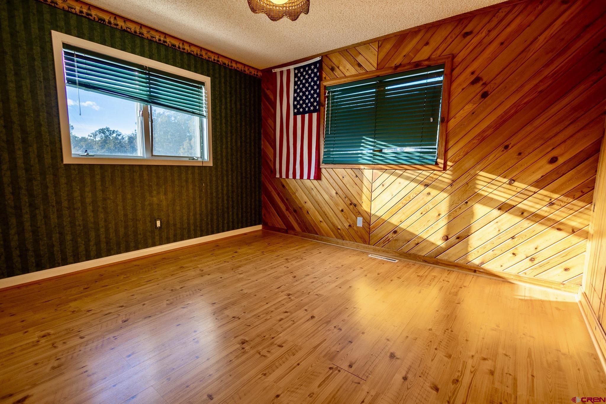 301 Tree Farm Drive Basalt, CO 81621 - Photo 26 of 35 a view of an empty room with a window and wooden floor
