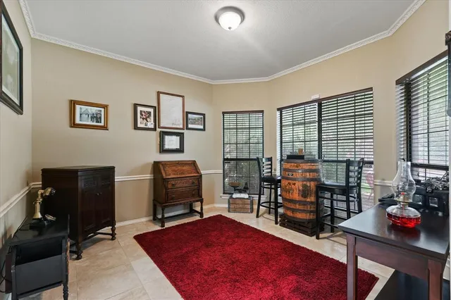 a bedroom with furniture and a flat screen tv
