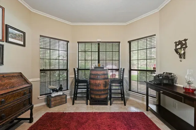a bedroom with furniture and a window