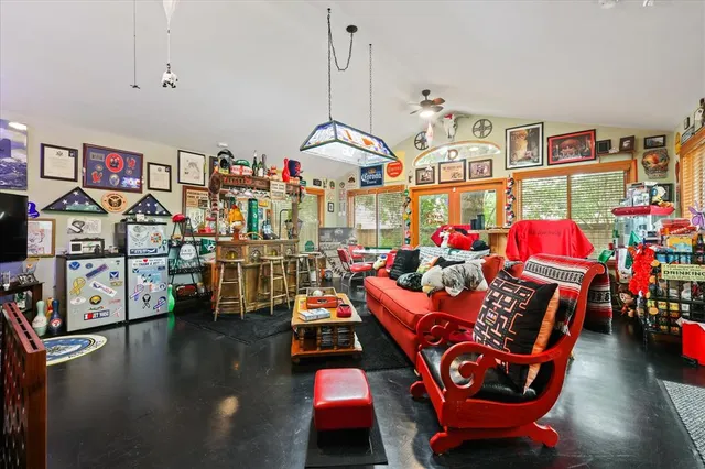 a play room with furniture and a chandelier