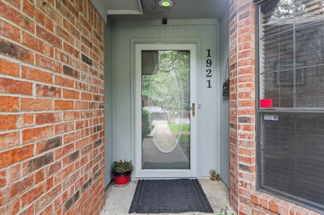 a view of a door and a window
