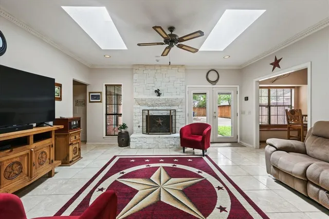 a living room with furniture flat screen tv and a fireplace
