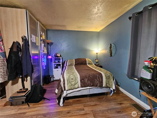 a bedroom with a bed and a closet