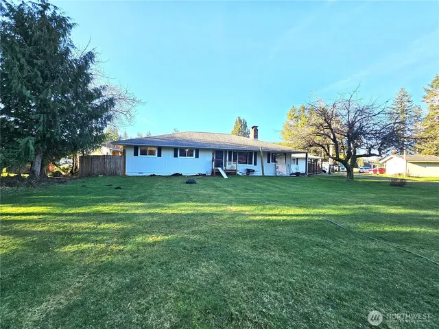 a view of a house with a big yard
