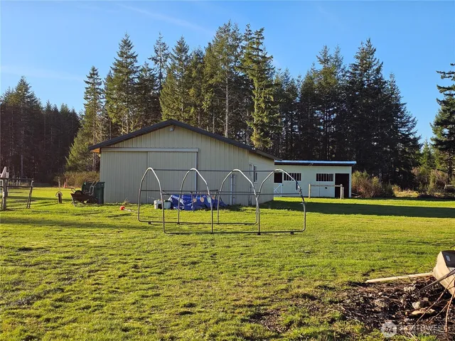 a house that has a big yard with large trees