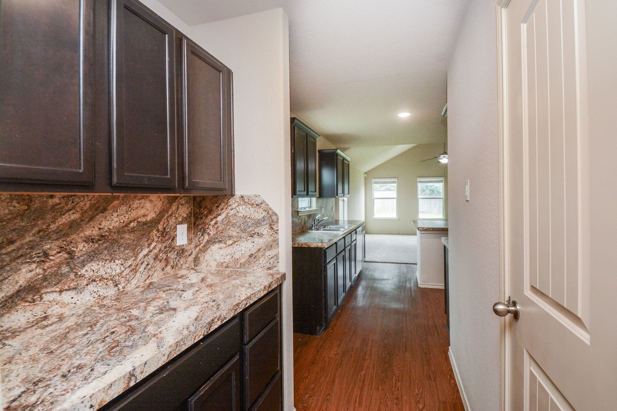 2003 Treasure Mountain Drive Spring, TX 77388 - Photo 7 of 20 a bathroom with a granite countertop sink a toilet and bathtub