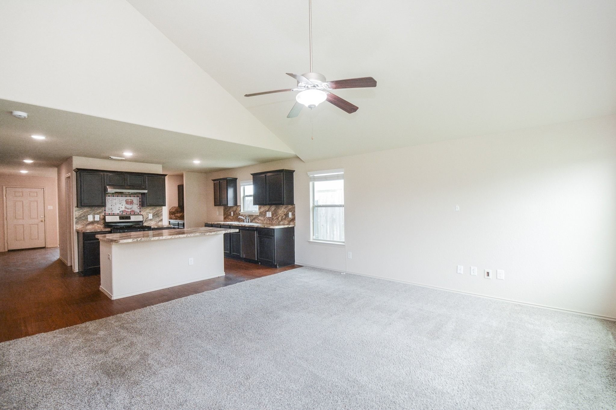 2003 Treasure Mountain Drive Spring, TX 77388 - Photo 8 of 20 a view of kitchen with kitchen island a sink appliances and a counter top space