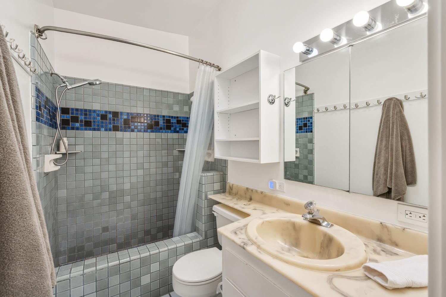 5229 Overbrook Way Sacramento, CA 95841 - Photo 20 of 28 a bathroom with a sink a toilet and shower