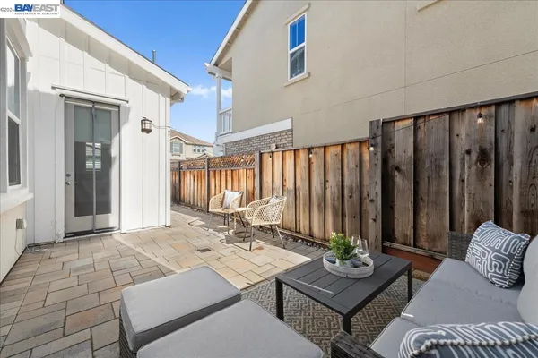 a view of yard with patio