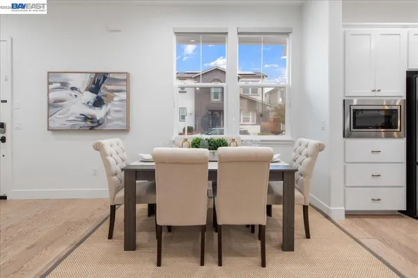 a view of a dining room with furniture window and outside view