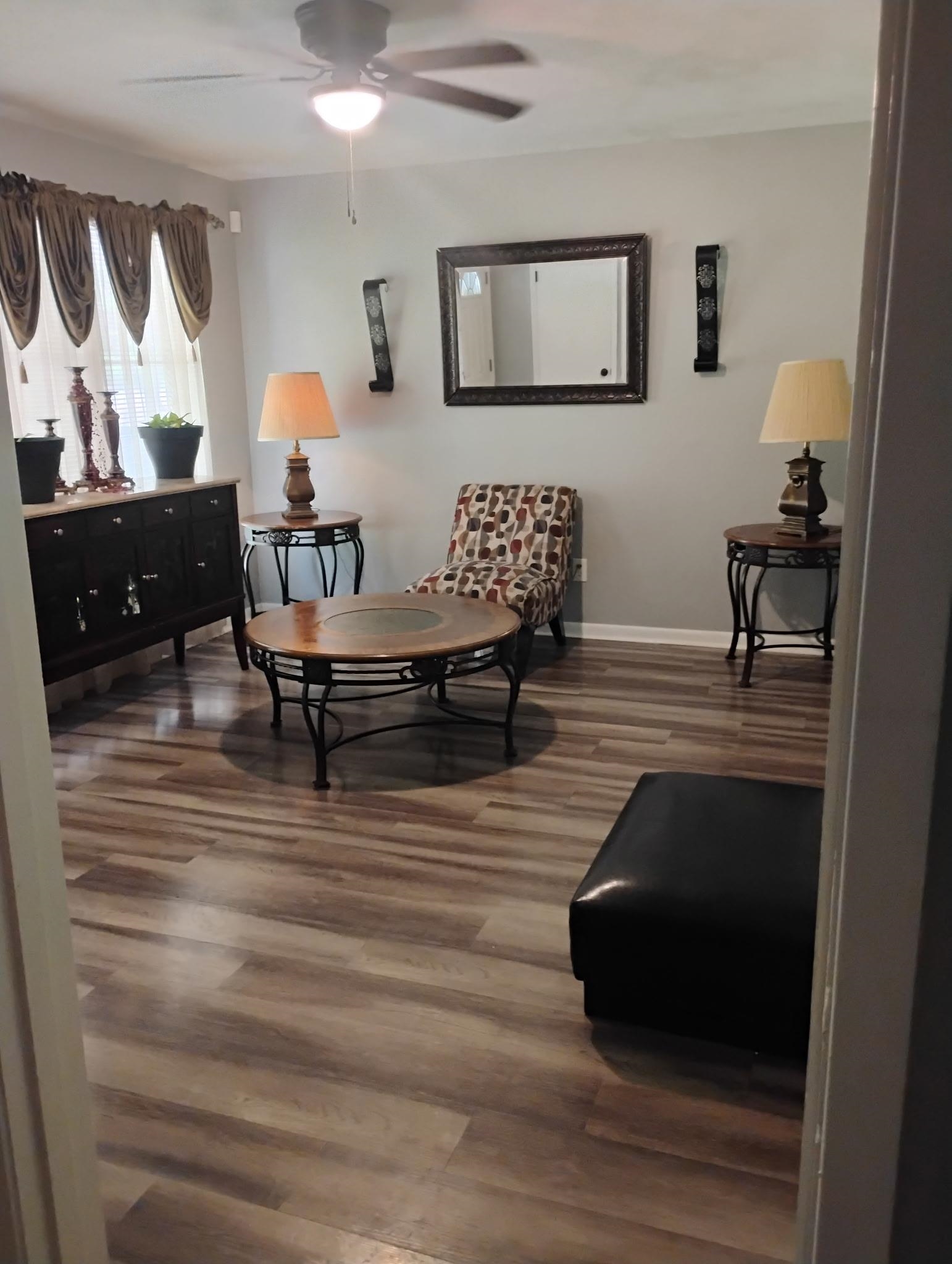 3492 Neely Road Memphis, TN 38109 - Photo 2 of 15 a living room with furniture and a wooden floor