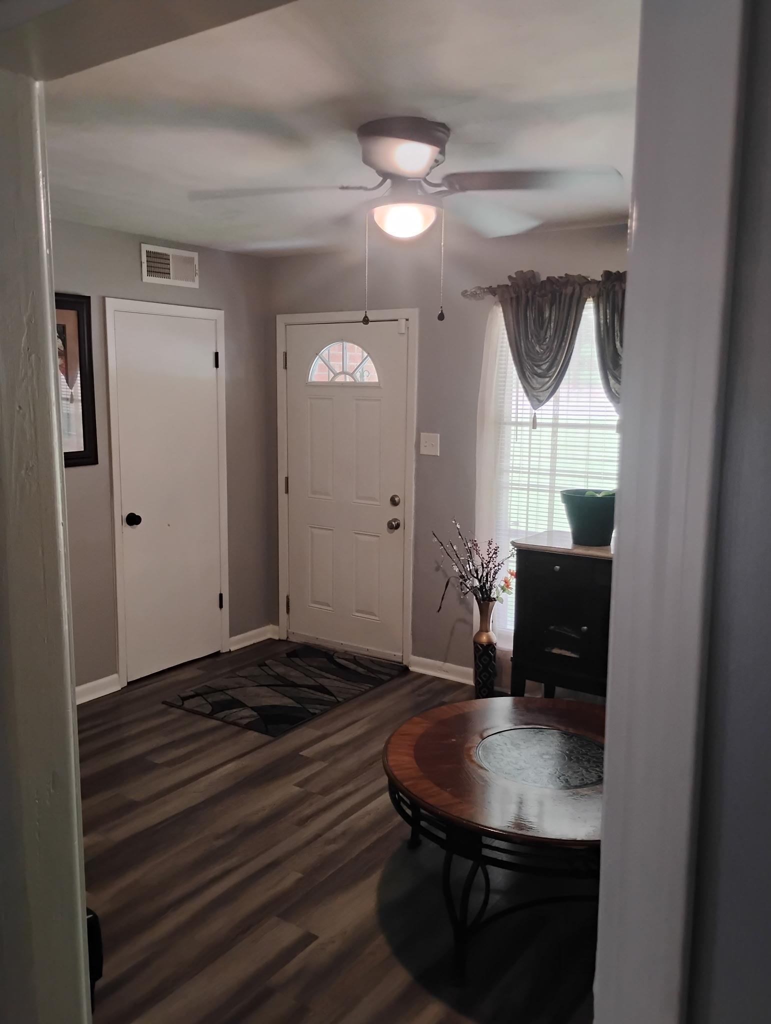 3492 Neely Road Memphis, TN 38109 - Photo 3 of 15 a living room with table chairs and a wooden floor