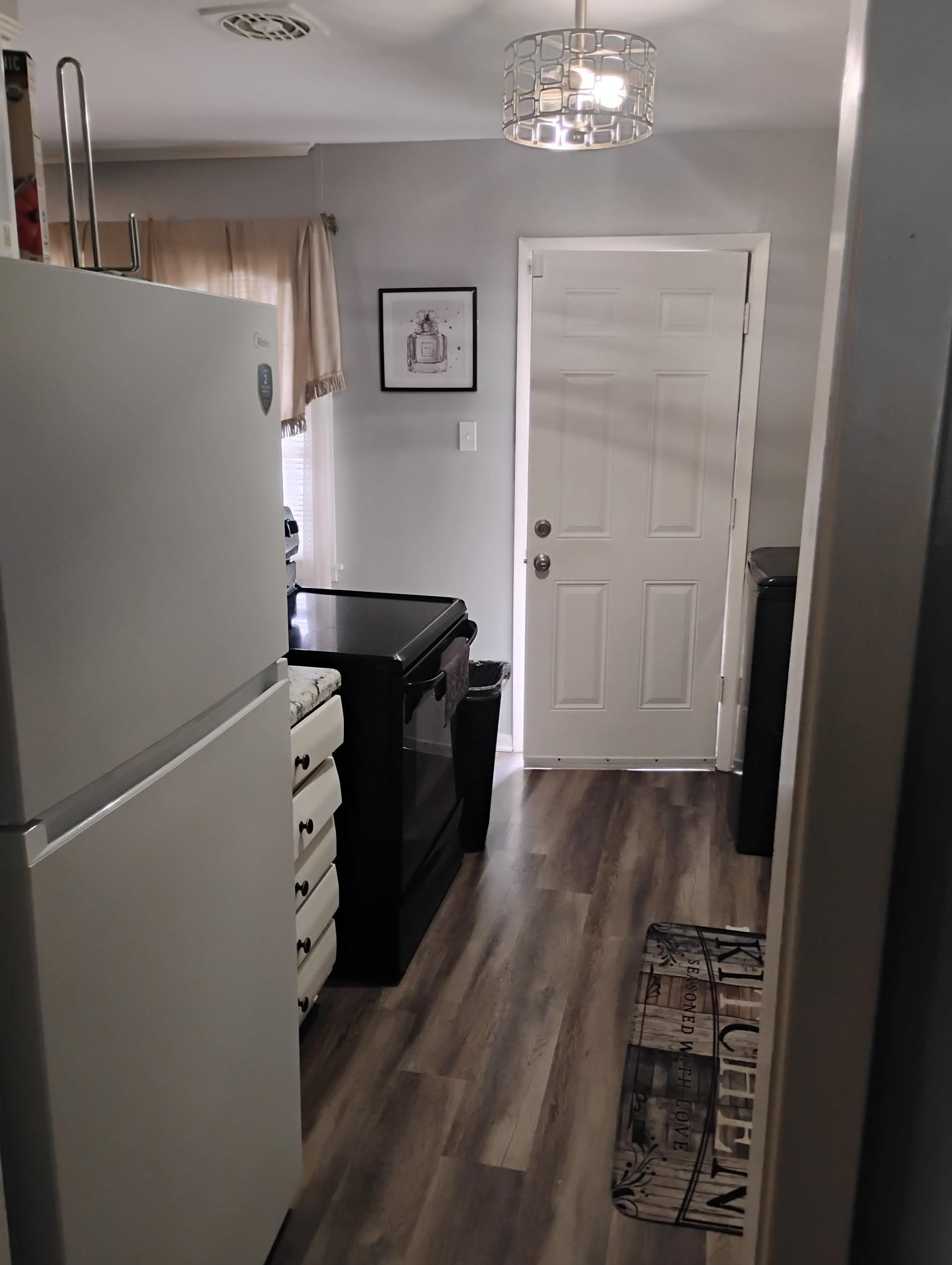 3492 Neely Road Memphis, TN 38109 - Photo 5 of 15 a view of a closet area with wooden floor