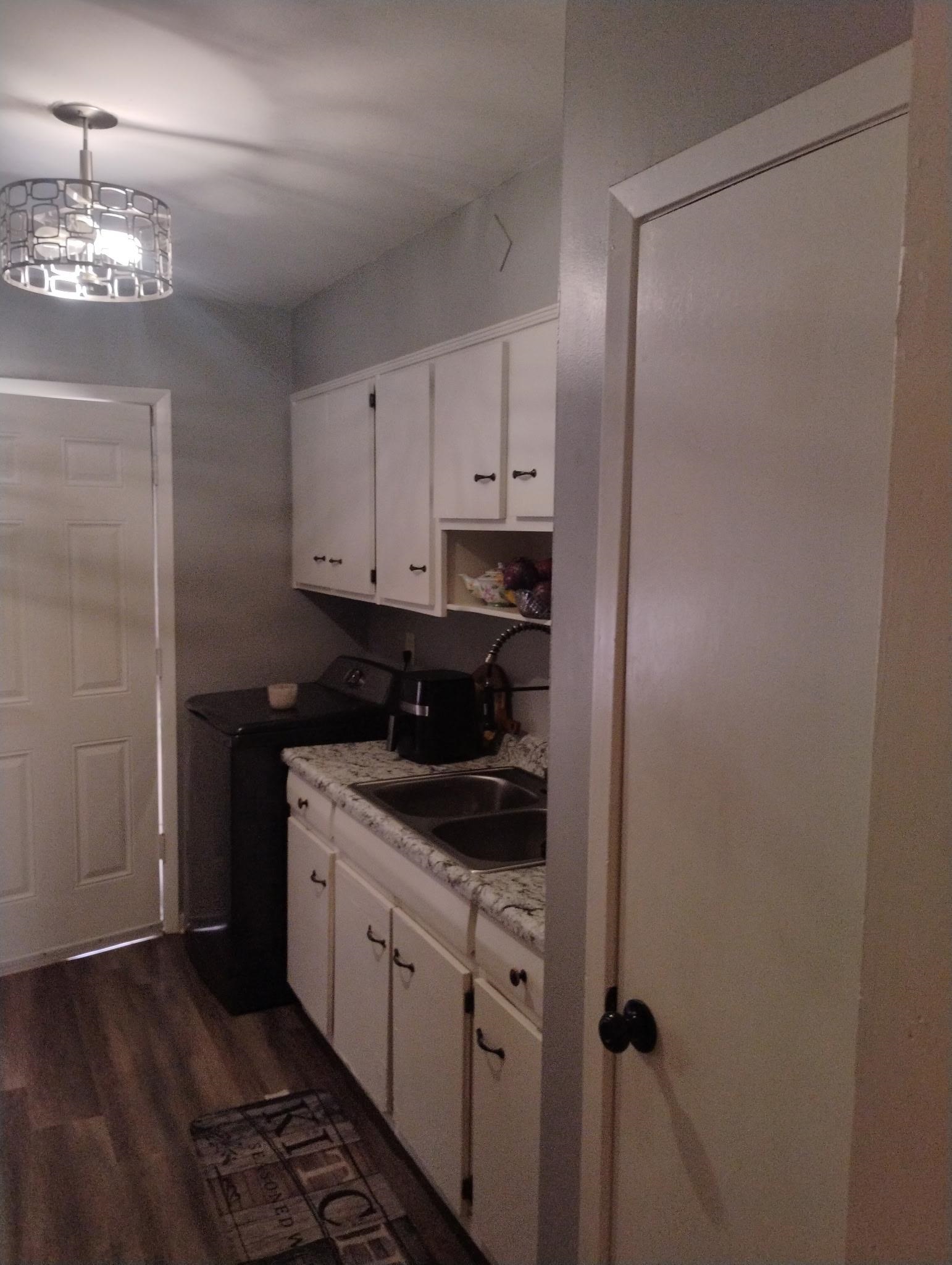 3492 Neely Road Memphis, TN 38109 - Photo 6 of 15 a view of a kitchen from the hallway