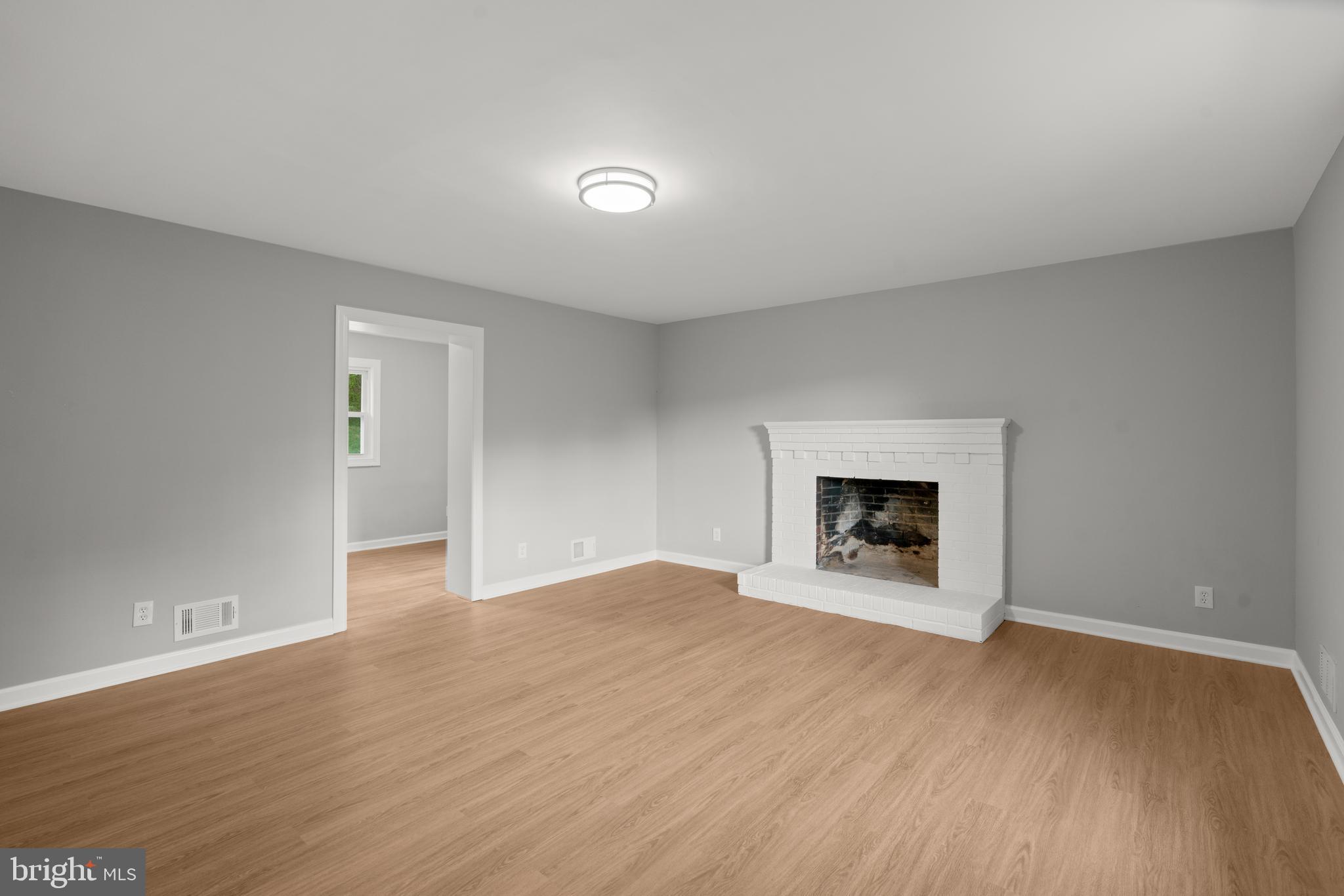 7946 Max Blobs Park Road Hanover, MD 21076 - Photo 15 of 47 Family room with a second fireplace
