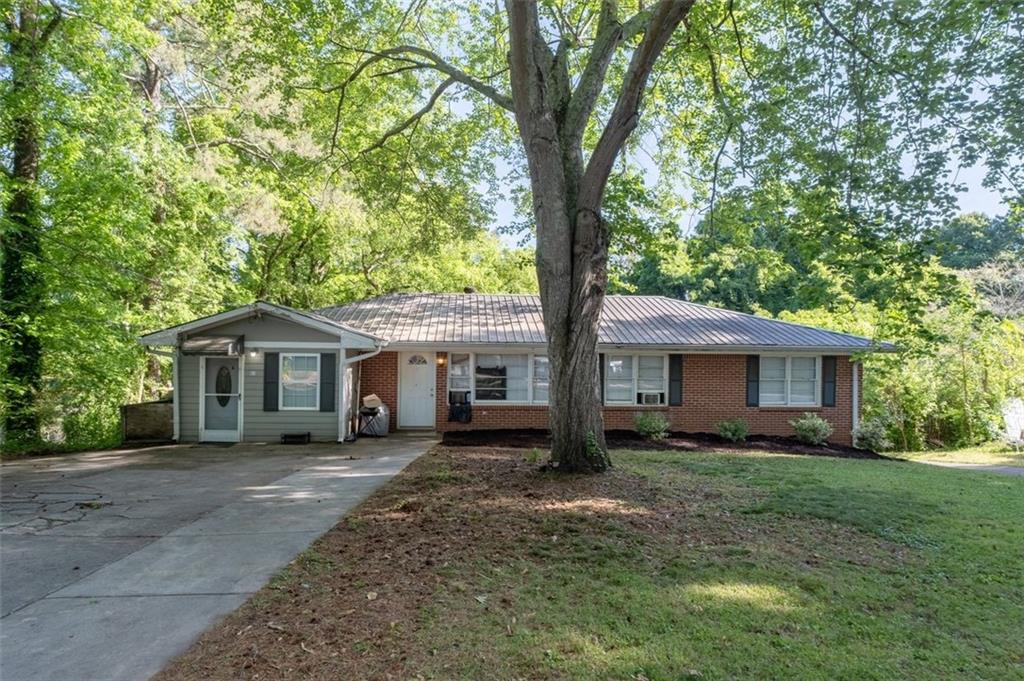 913 Old Noonday Sch House Road Marietta, GA 30066 - Photo 1 of 42 a front view of house with yard and green space