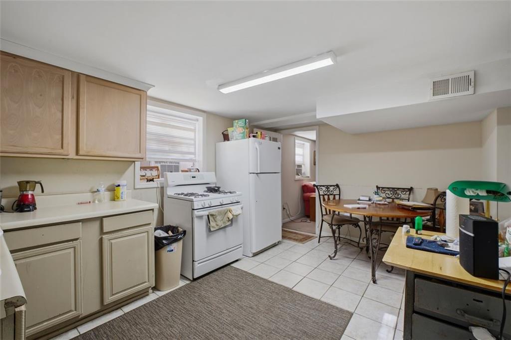 913 Old Noonday Sch House Road Marietta, GA 30066 - Photo 14 of 42 a kitchen with white cabinets and white appliances