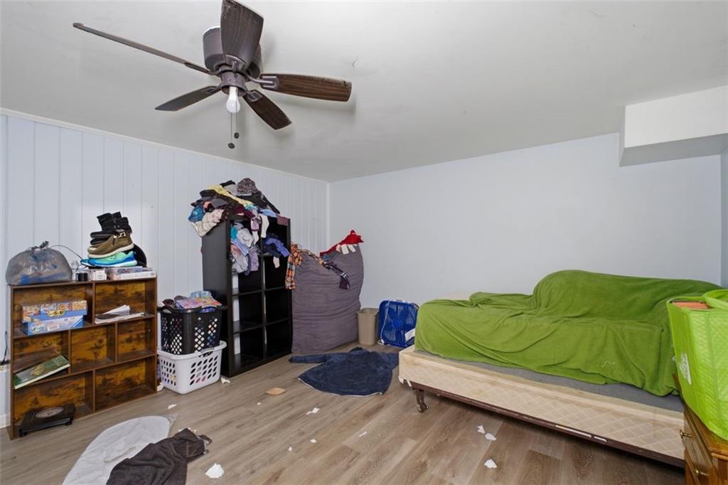 913 Old Noonday Sch House Road Marietta, GA 30066 - Photo 28 of 42 a bedroom with a bed and a window