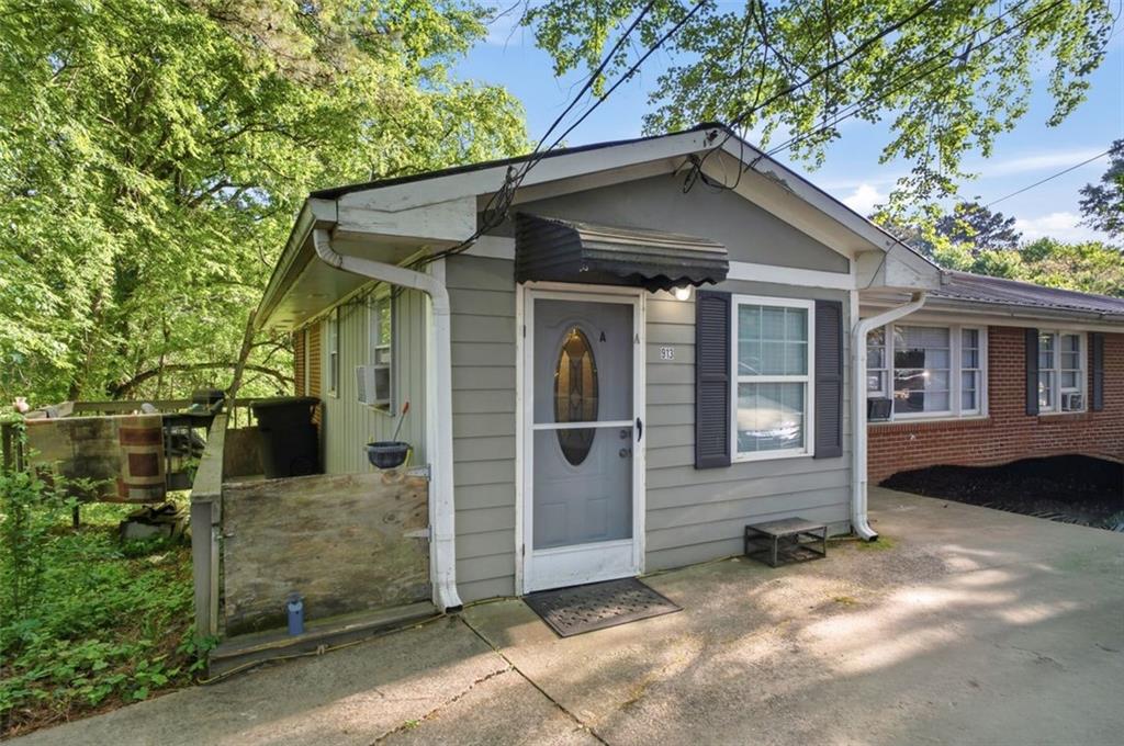 913 Old Noonday Sch House Road Marietta, GA 30066 - Photo 3 of 42 a front view of a house with a yard