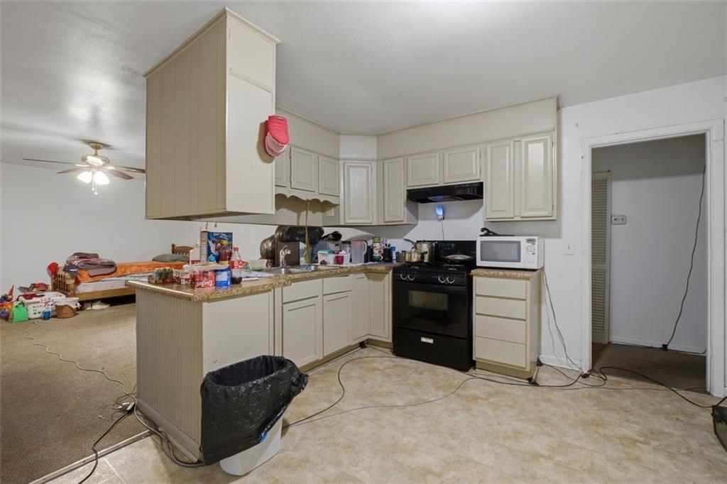 913 Old Noonday Sch House Road Marietta, GA 30066 - Photo 32 of 42 a kitchen with a sink and cabinets