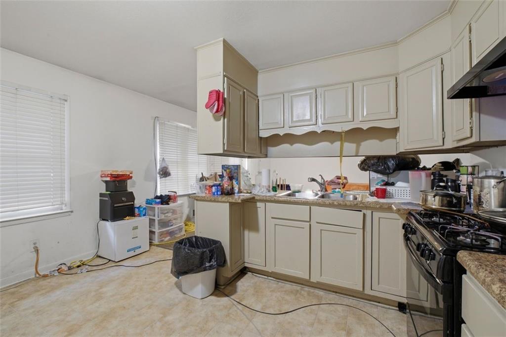 913 Old Noonday Sch House Road Marietta, GA 30066 - Photo 33 of 42 a room with cabinets and white appliances