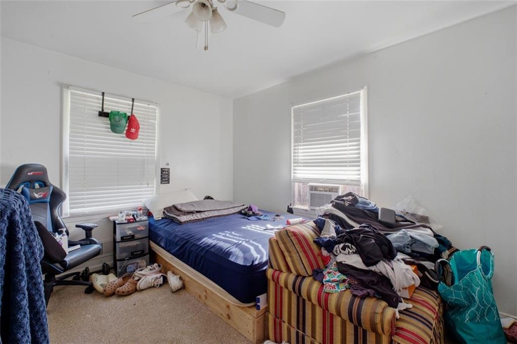 913 Old Noonday Sch House Road Marietta, GA 30066 - Photo 36 of 42 a bedroom with a bed and a window