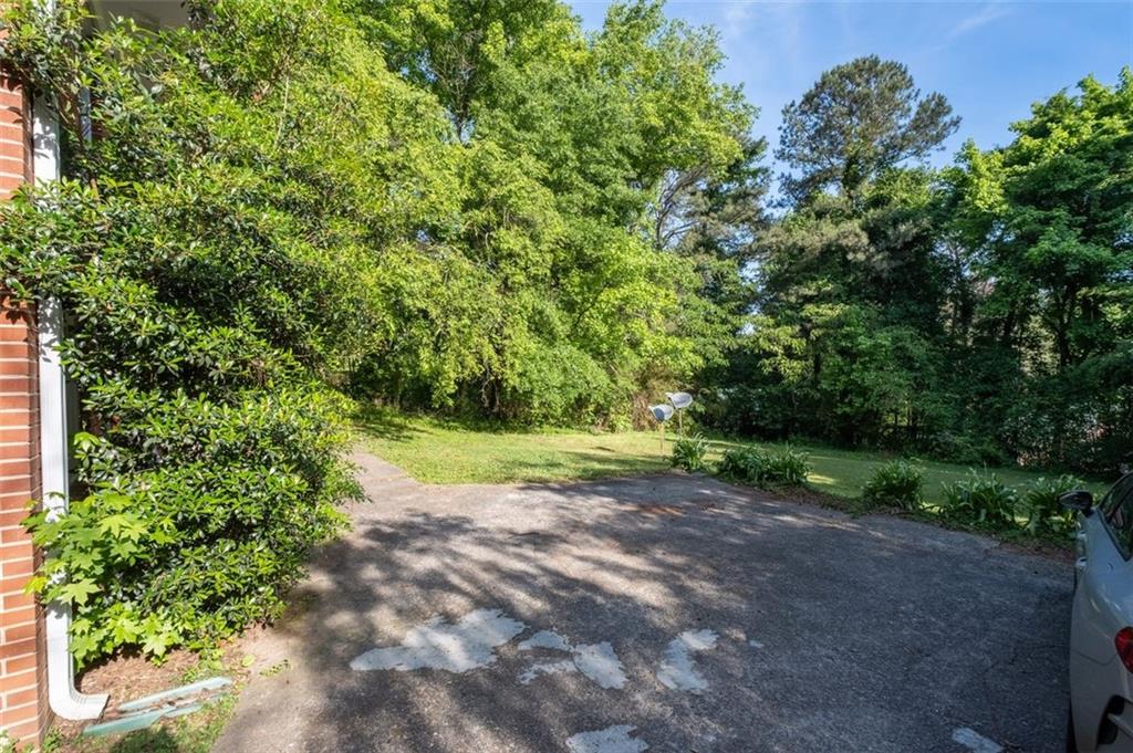 913 Old Noonday Sch House Road Marietta, GA 30066 - Photo 37 of 42 a view of a yard with a tree