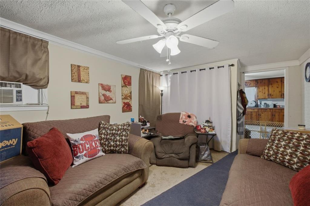 913 Old Noonday Sch House Road Marietta, GA 30066 - Photo 5 of 42 a living room with furniture and a chandelier